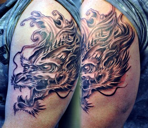 Dragon head tattoo by gettattoo on DeviantArt