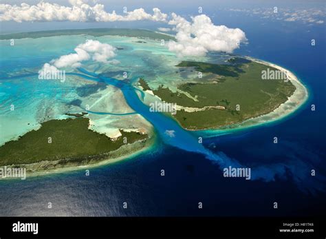 Aerial View Of Tidal Channels Feeding Central Lagoon Of Raised Coral