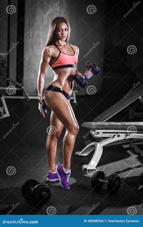 Athlete Girl With A Dumbbell In The Gym Stock Photo Image Of Machine