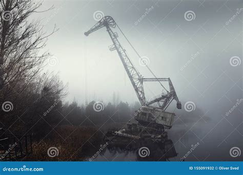 Rusty Old Industrial Dock Cranes At The Abandoned Dock Stock Photo