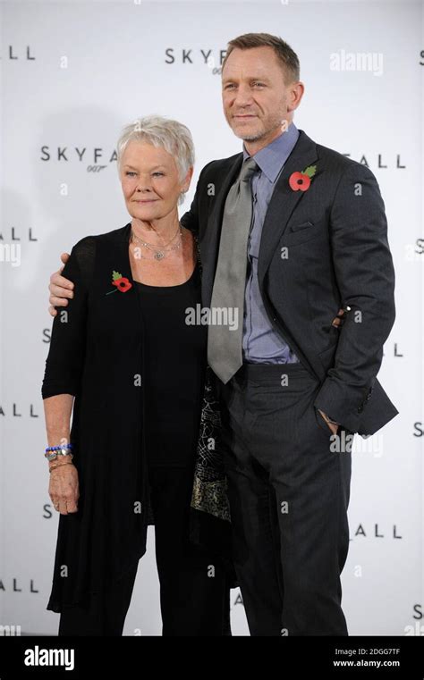 Dame Judi Dench And Daniel Craig At A Photocall For The New James Bond