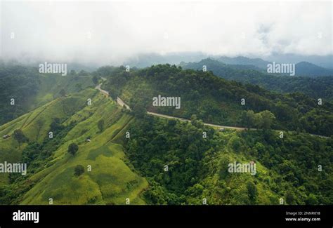 Aerial View Drone Fly Over Countryside Road Passing Through The Green