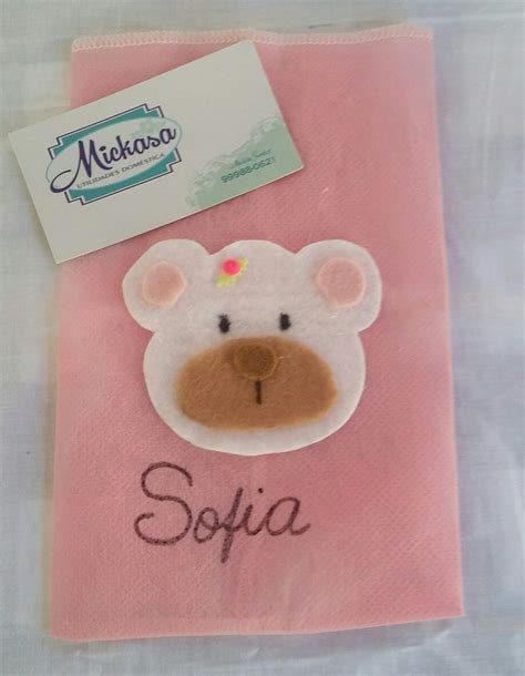 A Pink Towel With A Brown Bear On It And The Name Sofia Written In Black