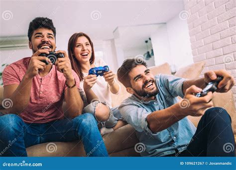 Group Of Young Friends Play Video Games Together Stock Image Image Of