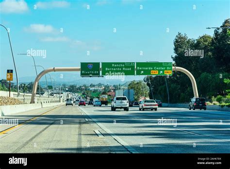 Guide Signs On Large Overhead Signage Informing Drivers About The