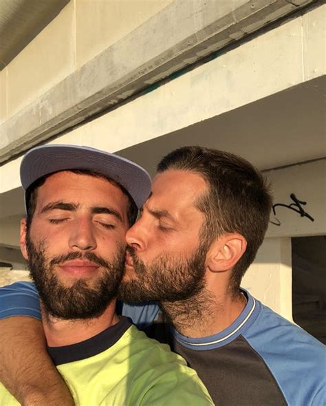 Two Men Who Are Kissing Each Other