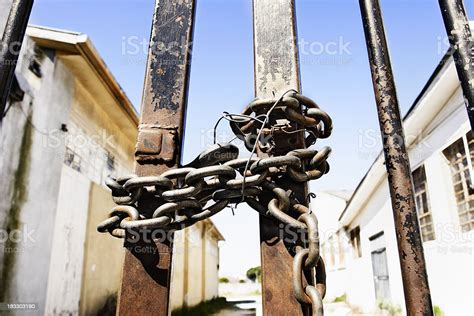 Gates To An Abandoned Industrial Complex Are Chained Shut Stock Photo