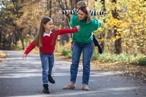 Premium Photo | Mother with children walking in park