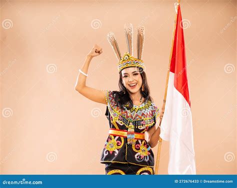 Excited Woman in Traditional Clothes of Dayak Tribe Standing with ...