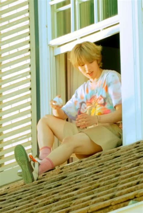 Shotaro With Long Blonde Hair In A Tie Dye Shirt And Shorts Sitting Out