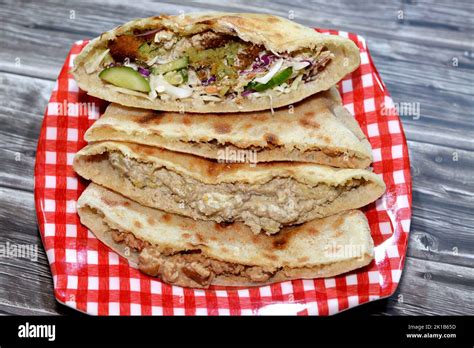 Traditional Egyptian popular breakfast street sandwiches of mashed fava ...