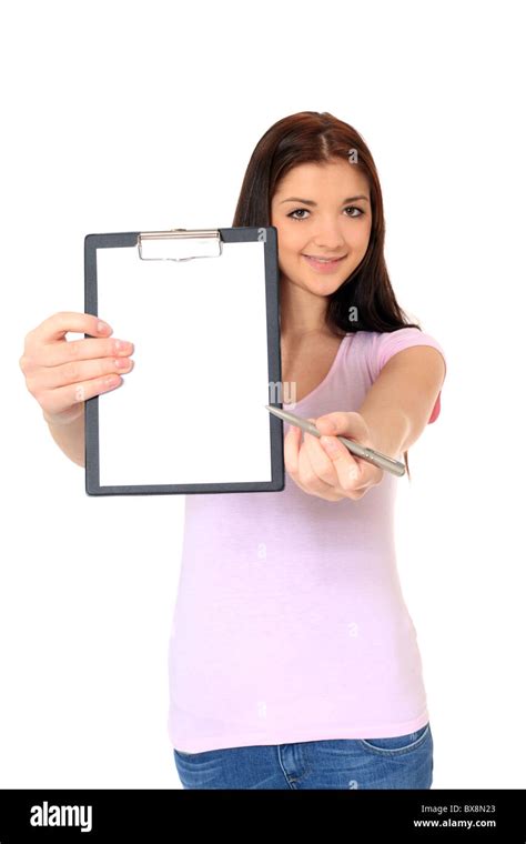 Attractive Teenage Girl Pointing At Clipboard All On White Background