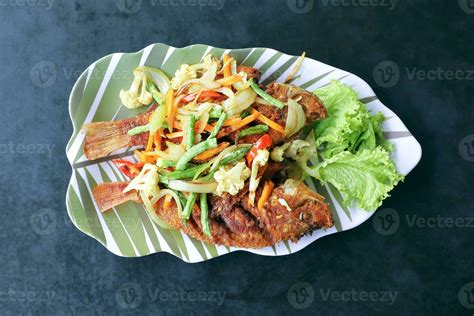 Deep fried tilapia fish 24334174 Stock Photo at Vecteezy