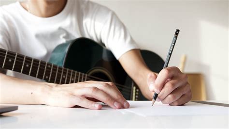 Close Up Shot of a Person Writing on a Paper · Free Stock Photo