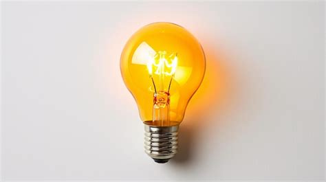 Premium Photo | Yellow Bright Light Bulb on White Background