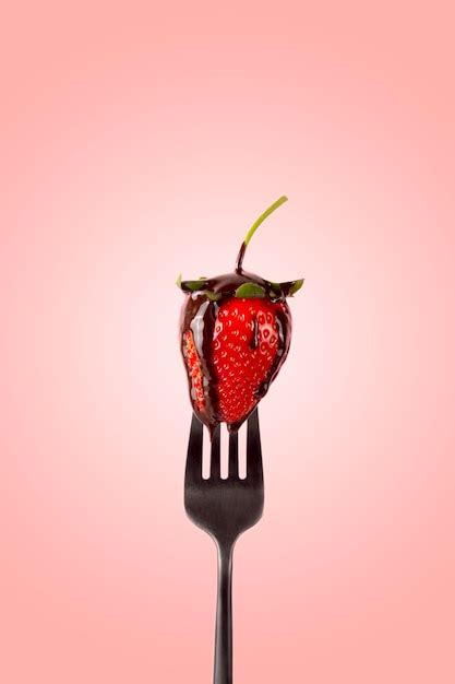 Premium Photo Close Up Of Strawberry Against Red Background