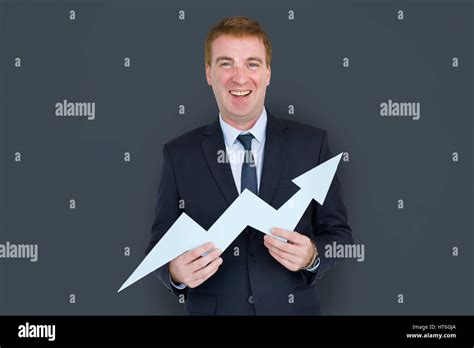 Caucasian Business Man Holding Growth Graph Stock Photo Alamy