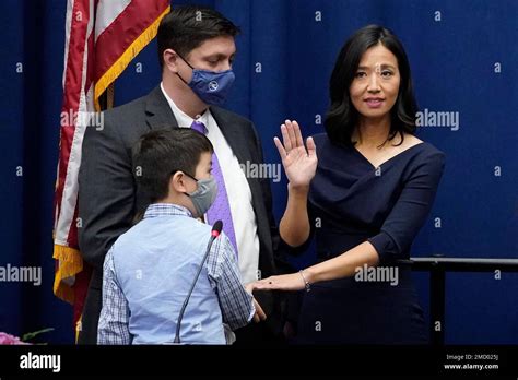 Michelle Wu Raises Her Hand As She Is Sworn In As Boston Mayor During A