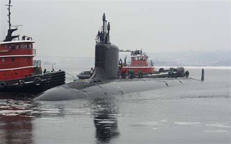 1st female officer reports to submarine USS Minnesota | Stars and Stripes