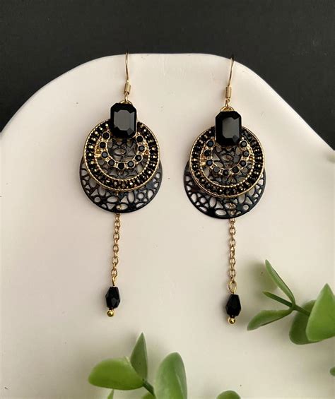 Boucles d oreilles noir et doré Lyrique