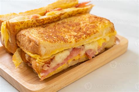 Homemade French Toast With Ham Bacon And Cheese Sandwich With Egg