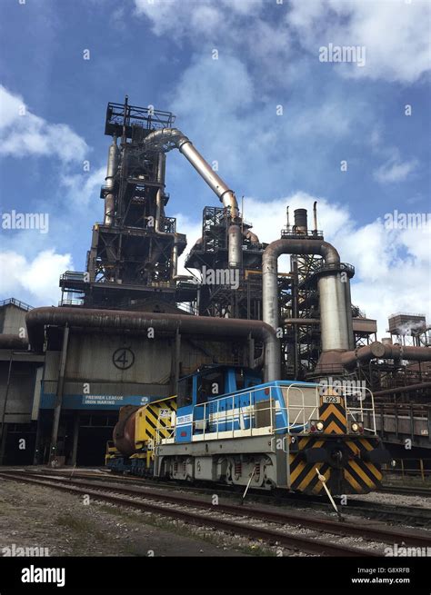 A train goes into blast furnace four at Port Talbot steelworks as ...