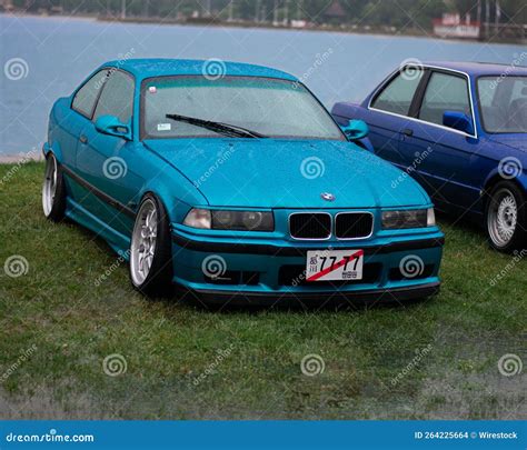 Wet Blue Bmw 3 Series E36 Car On The Lakeshore At A Car Meet Outdoors