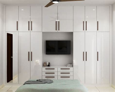 White Door Wardrobe Design With External Drawers And Lofts Livspace