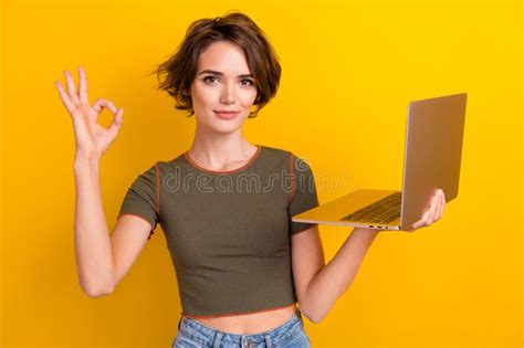 Photo Of Satisfied Girl With Bob Hairstyle Dressed Khaki T Shirt Hold