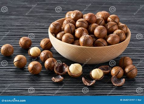 Macadamia In Wooden Bowl On Black Table Stock Image Image Of