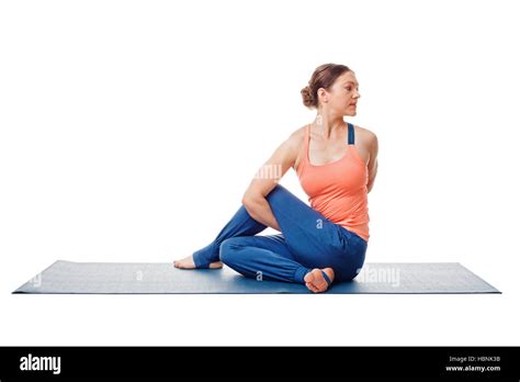 Woman Doing Ashtanga Vinyasa Yoga Asana Marichyasana D Stock Photo Alamy