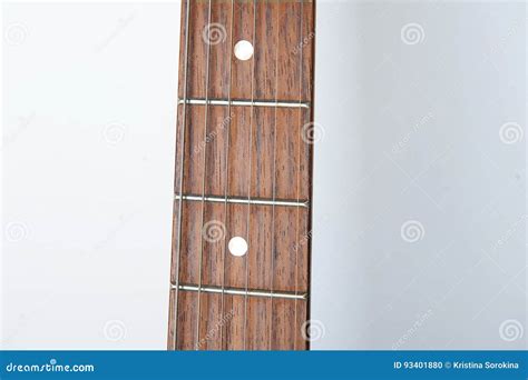 Guitar Neck With Strings On A White Background Free Space For Design