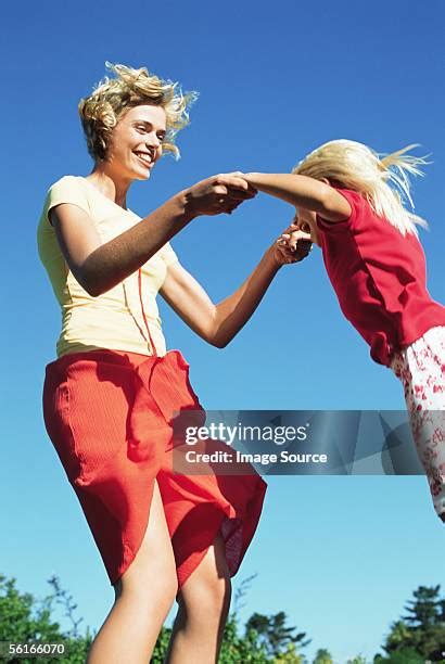 Mom Daughter Jumping Photos And Premium High Res Pictures Getty Images