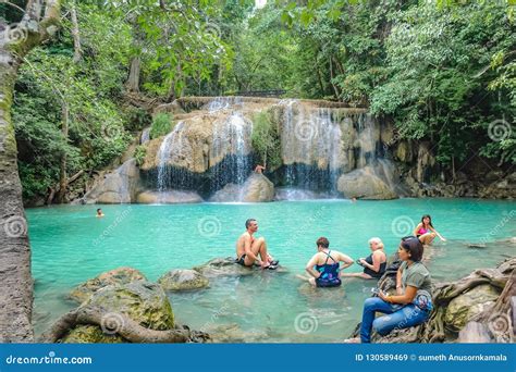 Deep Forest Waterfall With Tourist In Erawan National Park Kanchanaburi