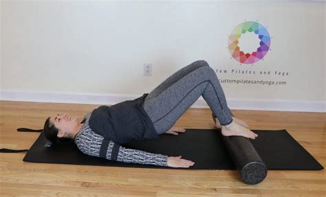 Challenge Your Stability By Practicing Bridge With A Foam Roller