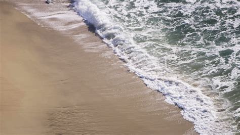 Gentle Ocean Waves Lapping On Clean Sandy Beach Slow Motion Shot On Red