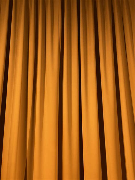 Yellow Curtain In Close Up Photography Photo Free Orange Background Image On Unsplash