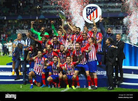 Atletico Madrid players celebrate with the trophy after winning the ...