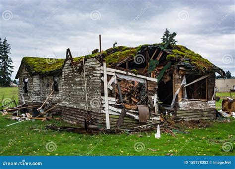 Ruins Of Abandoned House On Cold Fall Day Before Final Demolition