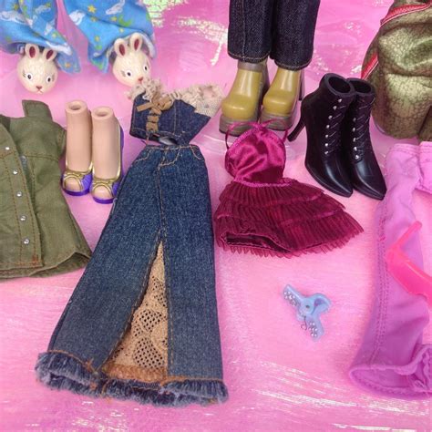 Mixed bundle of bratz dolls plus clothes, shoes,... - Depop