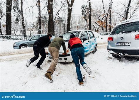 Group People Pushing Car Snow Stock Photos - Free & Royalty-Free Stock Photos from Dreamstime