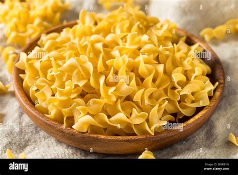 Raw Dry Egg Noodles Ready To Cook Stock Photo Alamy