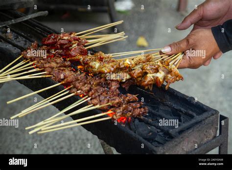 Chicken Satay Grill At A Busy Street Food Market Stock Photo Alamy