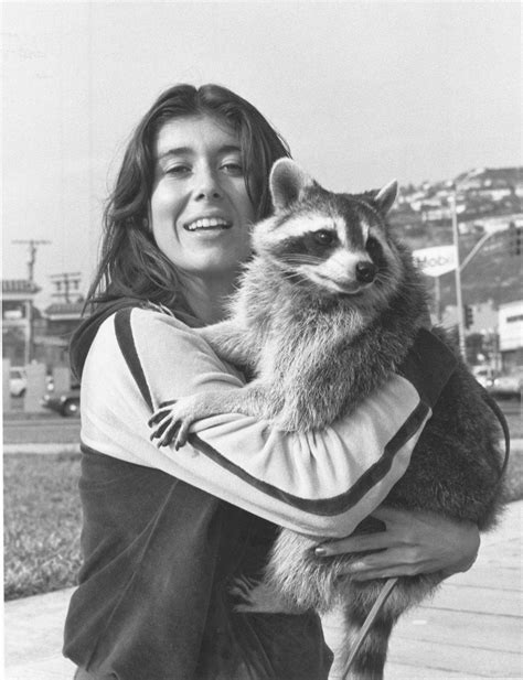 My hippie mother holding someone’s pet raccoon some time in the late 60s