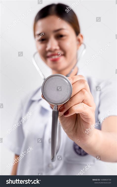 Asian Female Doctor Holding Stethoscope Hand Stock Photo 1698804739