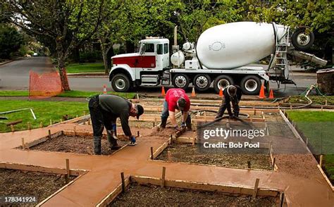 Concrete Truck Pouring Concrete Photos and Premium High Res Pictures ...