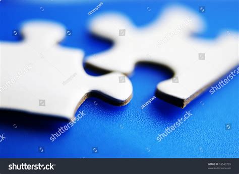 closeup  puzzle pieces fitting  stock photo