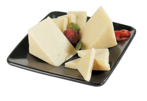 Sharp Cheddar Cheese with Garnish on Black Plate - Prepared Food Photos, Inc.