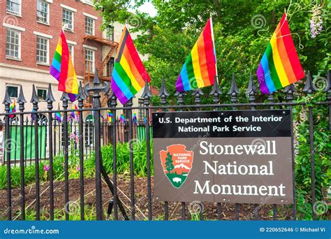 Stonewall National Monument Sign On The Fence Decorated With Rainbow