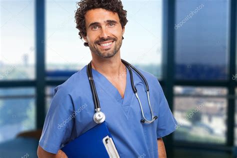 Male Doctor Smiles — Stock Photo © Minervastock 56553631